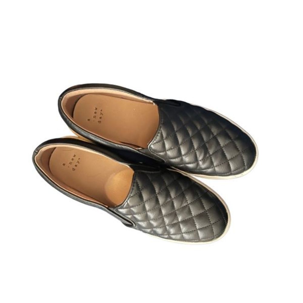 Black quilted flats